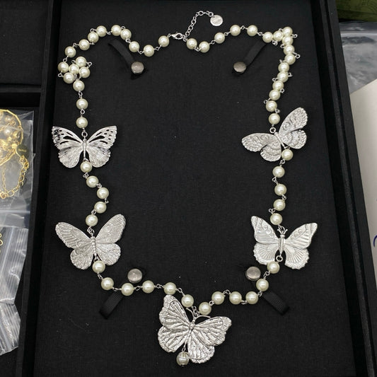 CD butterfly long pearl necklace