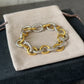 OVAL LINK CHAIN BRACELET
Sterling Silver with 18K Yellow Gold, 12mm